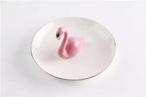 Nordic style ceramic flamingo jewelry dish with gold rim, perfect for rings and room decor.