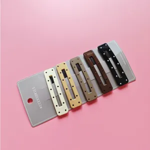 Set of 5 rectangular metal hair clips with dots on display card, multicolored detail view.