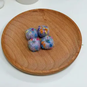 Colorful speckled knit yarn balls, fuzzy DIY craft beads for handmade jewelry accessories design.