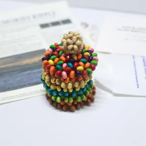 Handmade colorful wooden beaded ball detail, DIY jewelry accessory component showcase.