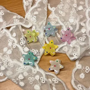 Cute mini translucent star hair claw clips set, colorful resin shark clips for daily styling.