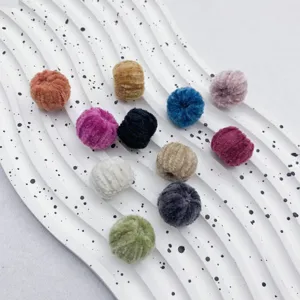 Fluffy plush pom pom charms for DIY jewelry making, fuzzy ball pendants for earrings and crafts.