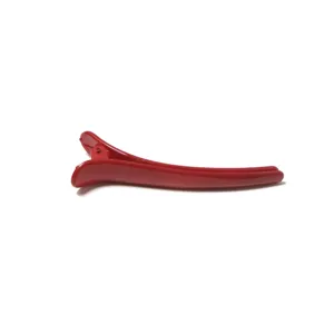Red plastic duckbill hair clip for daily makeup and washing face minimalist styling tool.