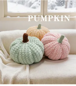 Cozy plush pumpkin pillow detail shot, soft textured fabric and realistic stem design.