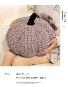 Cozy plush pumpkin pillow detail shot, featuring soft textured fabric and black stem for home decor.