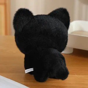 Cute black cat plush toy detail view, soft stuffed animal doll keychain hanging bag ornament.