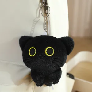 Black cat plush keychain detail, soft fuzzy material with cute embroidered eyes for bags.