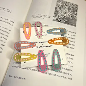 Colorful waterdrop hair clips with polka dots, cute duckbill clips for daily hair styling.