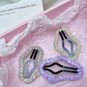 Close-up of cute knit hollow cloud hair clips set in pink gift box, soft wool side clips.