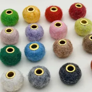 Colorful felt craft beads with metal eyelets for DIY jewelry making and phone straps accessories.
