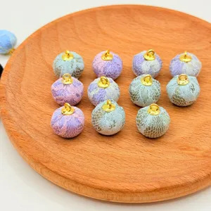Colorful fabric wrapped lace beads charm DIY jewelry clothing accessories detail view.