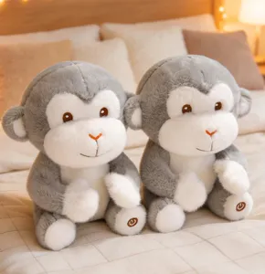 Detailed view of soft glowing monkey plush toy sitting on bed, cozy bedroom background.