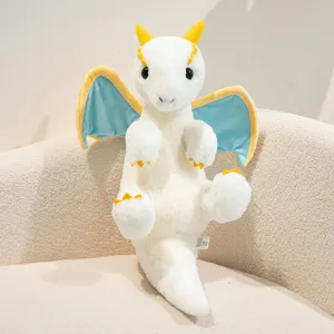 Close-up detail of the cute white and blue plush dragon toy, soft texture, cozy toy.