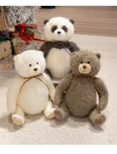 Detailed shot of cute knitted plush teddy bears and panda toys sitting on cozy carpet.