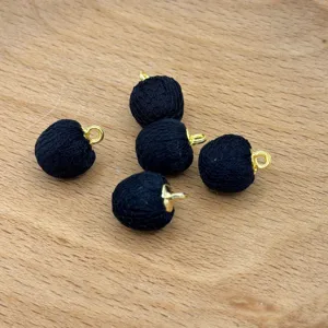 Black fabric covered beads with gold loops, perfect for DIY jewelry making and clothing accessories.