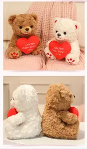 Details of plush teddy bear holding red heart pillow, soft toy for girls, cute gift