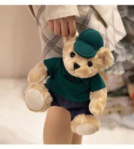 Cute dressed teddy bear plush toy close-up, soft stuffed animal doll with green hat and polo.