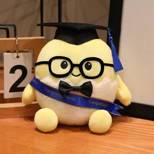Süßes gelbes Abschluss-Plüschtier im Ei-Design, Nahaufnahme mit Doktorhut und Brille.