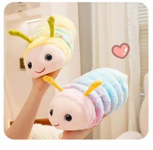 Colorful plush caterpillar toy detail showing soft pastel gradient fabric and cute smiling face.