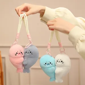 Cute magnetic seal plush toy keychain charm set, soft stuffed animal bag pendant gift for girls.