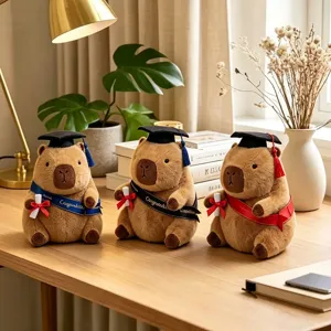 Cute capybara plush toy with graduation cap and gown set, perfect gift for students and kids.