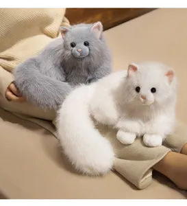 Detail view of realistic plush cat toy featuring soft fluffy fur and cute lifelike expression.