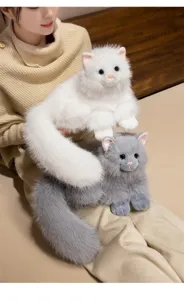 Close up of cute simulation fluffy cat plush toys in white and gray, soft cute doll details.