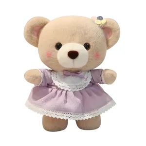 Cute teddy bear plush toy wearing a lovely purple princess dress with lace collar.