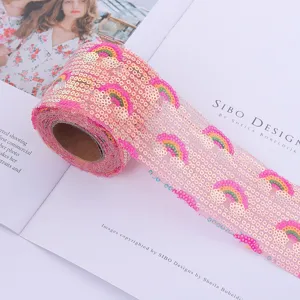 Pink sequin mesh ribbon with colorful rainbow embroidery for DIY crafts and festive party decor.