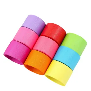 Colorful glitter grosgrain ribbon rolls for DIY hair bows, party decoration and gift wrapping.