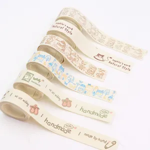 Close-up detail of cotton linen DIY craft ribbons with handmade prints and artistic style.