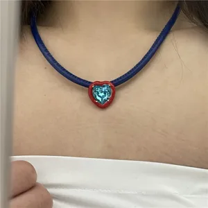 Blue PU leather choker necklace with a red heart light blue crystal pendant detail shot.