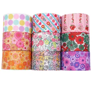 Kleurrijke 38mm ripslinten met bloemen en stippen prints voor knutselen en cadeaus.