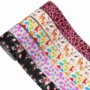 Cinta grosgrain estampada 25mm con diseños de animales y flores para manualidades y empaque de regalos.
