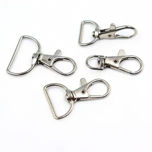 Detail view of silver metal swivel snap hooks and D-rings, perfect DIY hardware accessories.