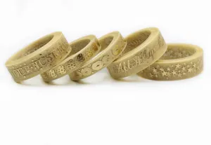 Gold stamped sheer organza ribbon rolls for DIY gift wrapping and hair bow crafts.