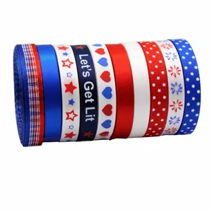 Close-up detail of patriotic US ribbon roll with stars, stripes, and festive designs.