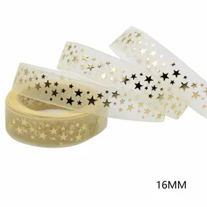 Close-up detail of gold star sheer organza ribbon, perfect for DIY crafts and gift wrapping.