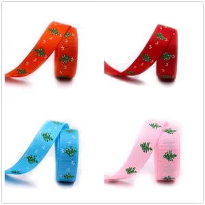 16mm Christmas grosgrain ribbon featuring tree and star print in four vibrant colors for gift wrap.