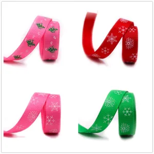 16mm Christmas ribbon with tree and snowflake patterns for holiday gift wrapping and decor.