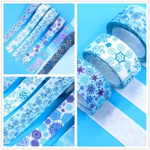 25mm blue snowflake grosgrain ribbon for DIY hair bows, gift wrapping, and holiday decorations.