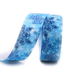 Blue snowflake grosgrain ribbon detail, festive DIY craft gift wrapping supply.