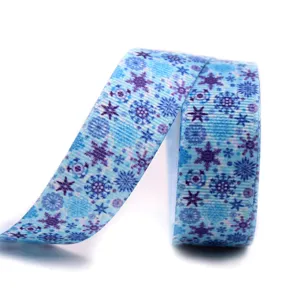 Blue snowflake ribbon detail shot, perfect for DIY bows, gift wrapping and holiday decor.