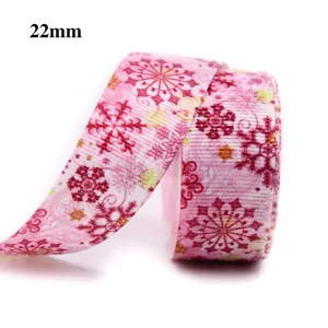 Détail de ruban de noël flocon rose 22mm, bordure en tissu pour emballage cadeau.
