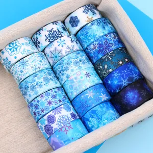 Blue snowflake grosgrain ribbon rolls for DIY hair bows, gift wrapping and holiday crafts.