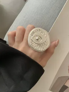 Chunky silver color statement ring featuring an intricate engraved eye relief design for women.