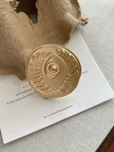 Vintage gold eye scarab relief statement ring, unique open finger ring detail shot accessory.