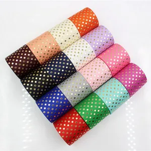 Gold foil polka dot grosgrain ribbon for hair bows gift wrapping and holiday decor details.