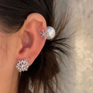 Close-up detail of shimmering zircon snowflake ear cuff and pearl earring design for daily wear.