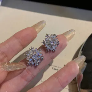 Sparkly snowflake cubic zirconia stud earrings, elegant silver tone daily wear jewelry for women.